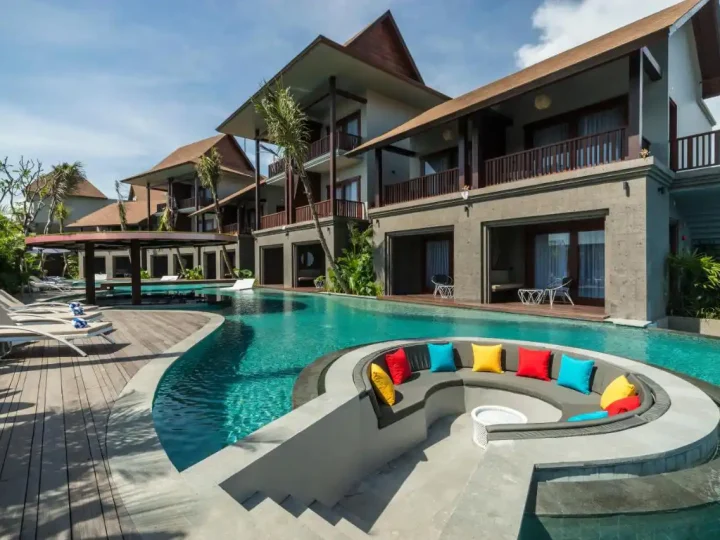 Boutique hotel pool deck with loungers and tropical planting