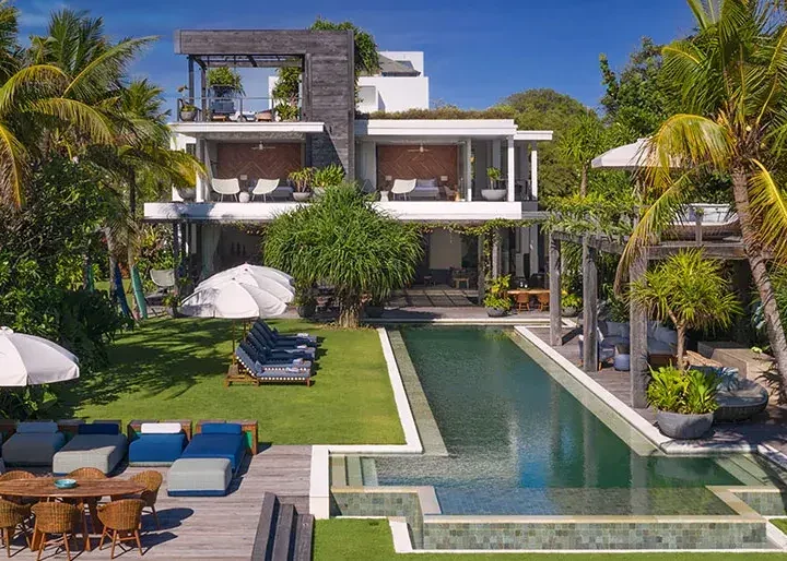 Enclosed courtyard villa with a tiled pool and planted walls