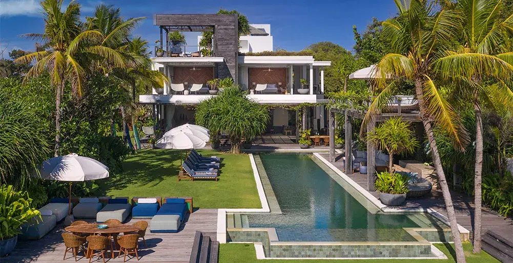 Enclosed courtyard villa with a tiled pool and planted walls