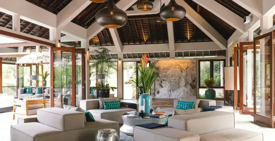 Open-sided villa living pavilion under an exposed timber roof